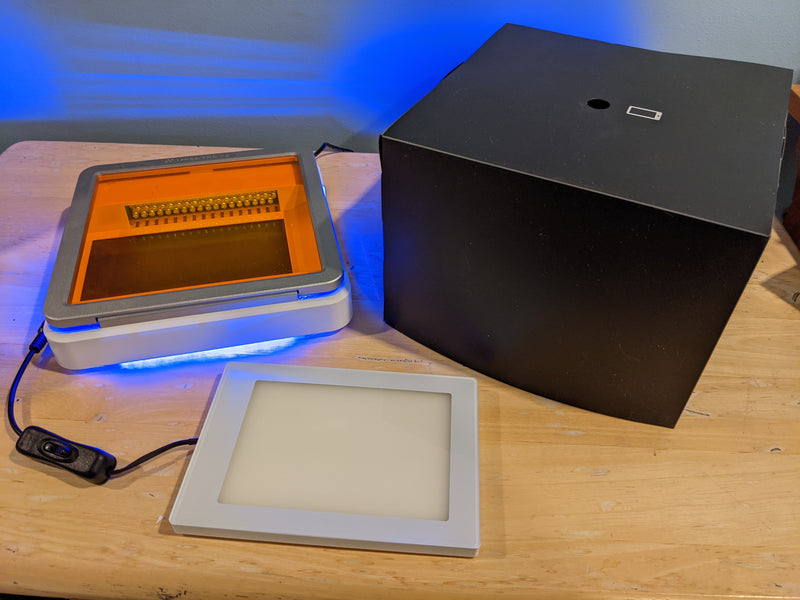 UltraSlim Blue LED Illuminator with imaging hood and white light panel.
